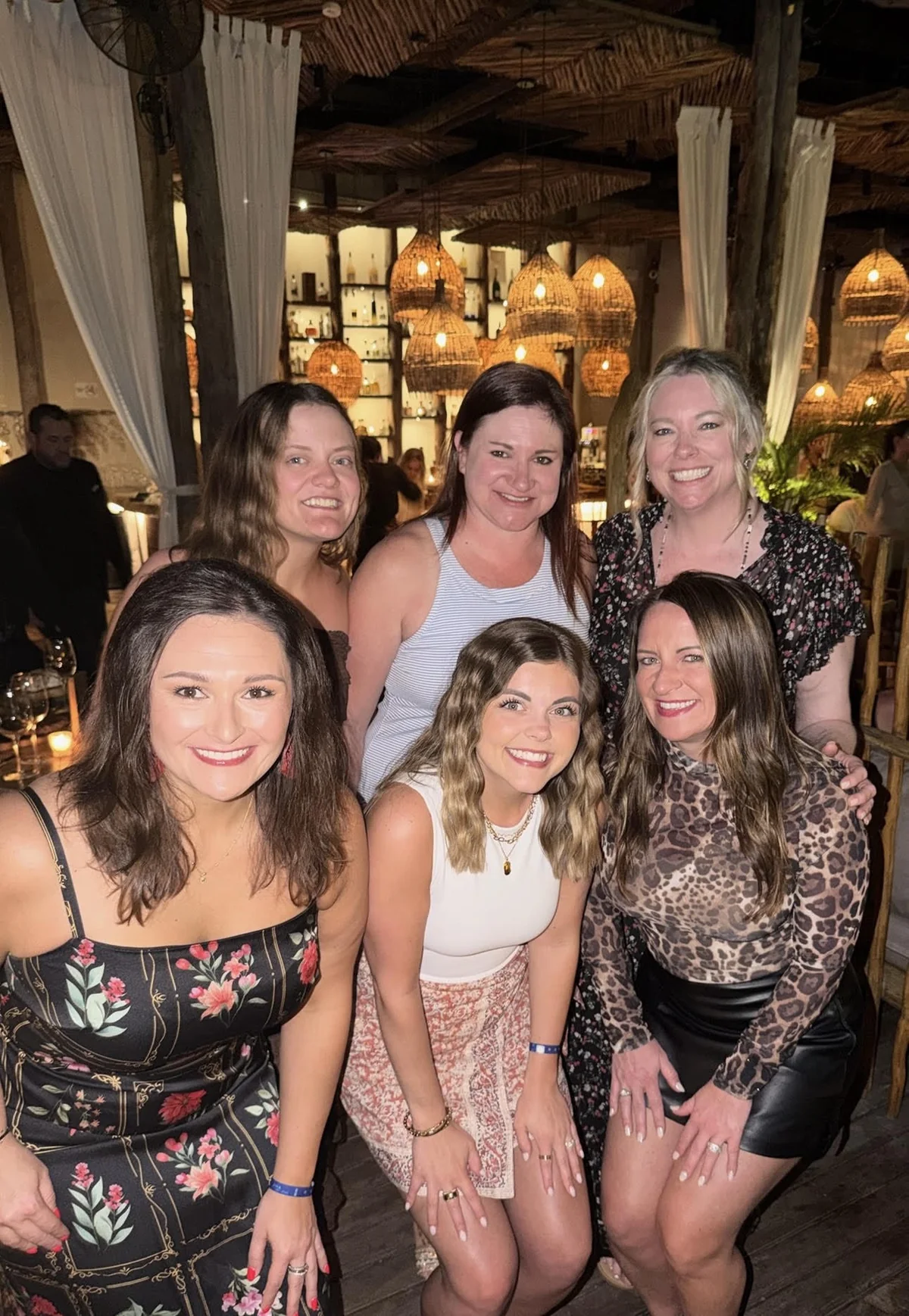 Tara Allen with five friends at a restaurant